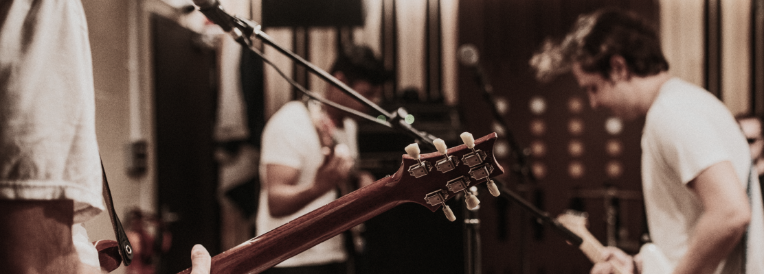 Music band guitarist performing repetition recording studio